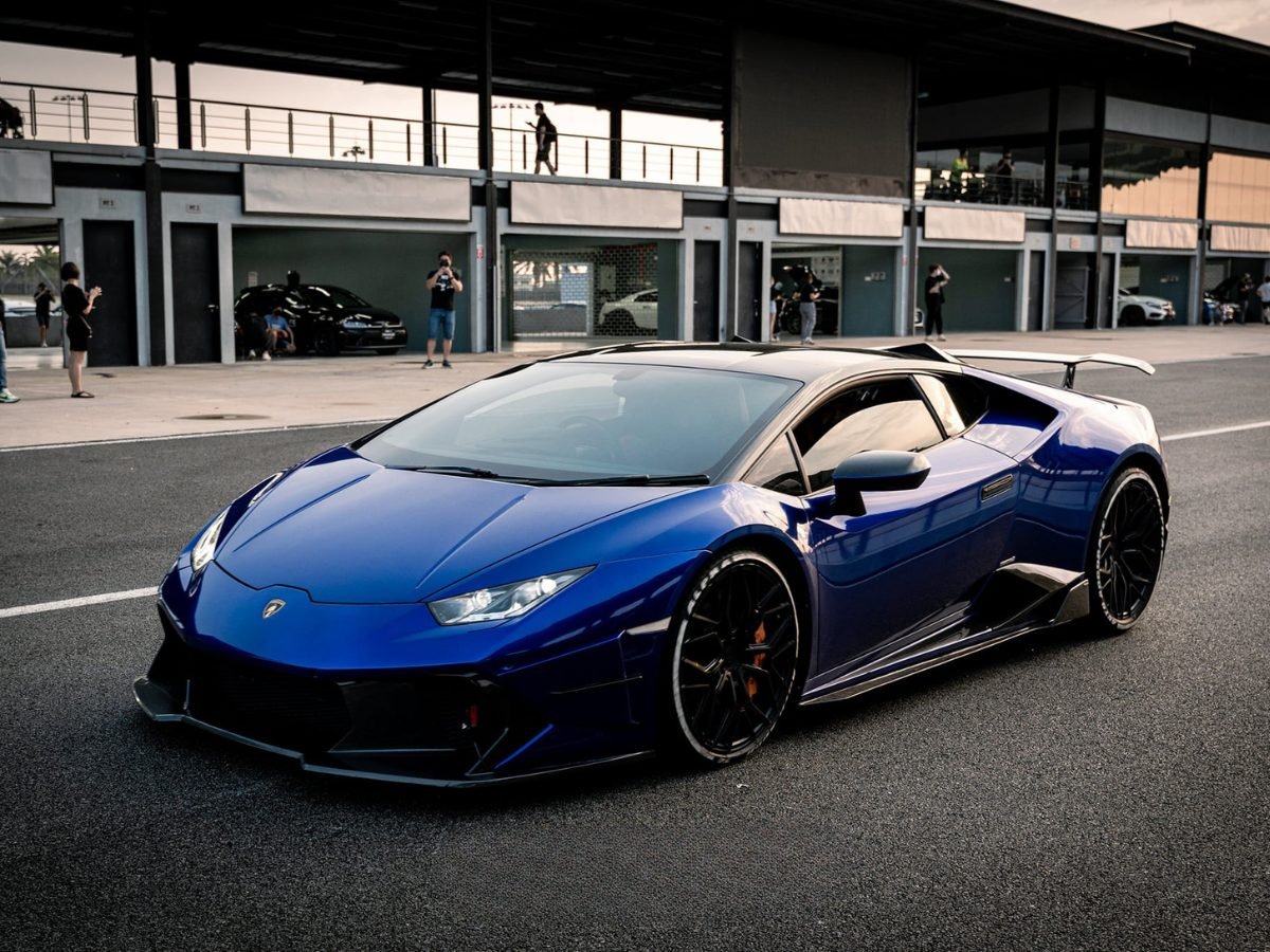 Blue widebody Lamborghini Huracan parked in the pit building